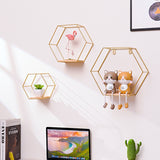 Hexagonal Shelves On Wrought Iron Wall